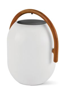 a white tea pot with wooden handle and handles on the front, sitting on a white surface