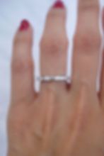 a woman's hand with a ring on it