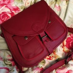 "Cross body Saddle Bag, Red Leather,bags purses,Purse, CrossBody Purse, leather Shoulder Bag Belt closure Soft fabric lined interior with two slip pockets and one zip close pocket Two snap button pockets under closing flap on front exterior PLEASE SEE MEASUREMENTS Measures:  W 12\" x H 11\" x Depth 3\" Straps: Drop 24\" Excellent condition.This is new /old stock and has never been used. Really nice perfectly clean inside and out. 242-273-105+280+87+dn Cross body Saddle Bag, Red Leather,bags purses,Purse, CrossBody Purse, leather Shoulder Bag" Red Leather Saddle Bag Shaped As Satchel, Red Leather Saddle Bag In Satchel Shape, Red Leather Satchel Saddle Bag, Red Flap Bag For Travel, Red Leather Saddle Bag With Detachable Strap, Burgundy Leather Pouch Shoulder Bag, Red Leather Rectangular Saddle Bag, Red Rectangular Satchel With Leather Lining, Red Leather Pouch Bag