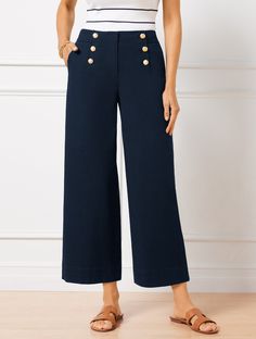 Sail into the season in style with our on-trend cropped sailor pants. Made from cotton. Detailed with sleek buttons. Features Flat Front/Trouser Wide Leg Hits At Waist Crop Length Fly front with hook & bar closure Front Slash, Back Patch pockets Imported Fit: Misses: 26"; Petite: 22 1/2"; Plus: 26"; Plus Petite: 22 1/2" Material: 98% Cotton, 2% Spandex Care: Turn Garment Inside Out; Machine Wash Cold, Gentle Cycle; Only Non-Chlorine Bleach When Needed; Tumble Dry Low; Warm Iron If Needed | Cotto Navy Sailor Pants Outfit, Sailor Pants Outfit, White Crop Pants, Sailor Pants, Navy Blouse, Vintage Wardrobe, Wide Jeans, Casual Chic Outfit, Crop Pants