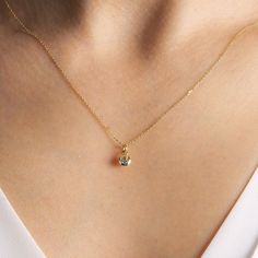 "Dainty 14K solid gold sky blue topaz pendant necklace. The bezel of the stone is designed with small windows under the bezel to get more light which shows the sparkle and color of the stone better. **Details** ✪ Pendant Material: 14K Solid Gold Stone: Sky Blue Topaz Total CTW: 0,15ct Cut: Round Approximate Dimensions: Stone: 3mm Bezel: 4,75mm (exluding jump ring) Charm: 9mm (including jump ring) ✪ Chain: Material: 14K Solid Gold Width: 0,50mm Length: 18 inches ( approx. 46cm ) Closure: Spring R Gold Dainty Necklace Celestite, Yellow Gold Aquamarine Birthstone Necklace, Gold Aquamarine Jewelry With Bezel Setting, Fine Jewelry Topaz With Bezel Setting, Blue Topaz Jewelry With Bezel Setting, Blue Topaz Birthstone Necklace For Anniversary, Anniversary Blue Topaz Birthstone Necklace, Blue Topaz Bezel Setting Jewelry Gift, Gold Aquamarine Birthstone Necklace