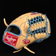 a close up of a catchers mitt on a black background with the word rawlings written on it