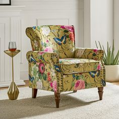 a living room with a chair and vase on the floor