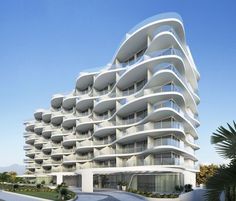 a large white building with balconies on it