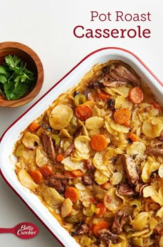 a casserole dish filled with meat, potatoes and carrots next to a bowl of parsley