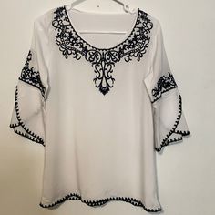 New/Flawless No Tags Found White Fabric That Feels Like Cotton/Blue Embroidery As Shown 3/4 Length Sleeves Tunic Length Size S/M Pit To Pit 19” Length 26” Boho, Tunic,Free Spirit, Feminine,Lightweight,Embroidered,Casual, Clothes For Women Over 50, Embroidery Designs Fashion, Boho Blouse, Blue Embroidery, Source Unknown, Boho Blouses, Tunic Length, Women Over 50, White Fabric