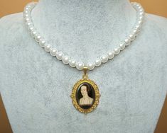 "Get 25% off when you buy 2 or more items using code \"sale 25\" *Anne Boleyn Pendant Necklace With Glass Pearl Beads *Necklace length 16.5 + 2 inches (42 + 5 cm). The pendant is resistant to tarnish. 8 mm quality glass pearl was used. *Picture print is placed inside the pendant and it is covered with resin. The resin is shiny and hard like glass. It is water and scratch resistant. *I make jewelry on order. Since it takes 24 hours for the resin to dry and harden, I ship your cargo 1-2 days after your order. If there are ready ones, I will ship them the same day. *I am sending your cargo in a small package in a bubble envelope. If you want to buy it as a gift, I can add your note to the package. You can write your note when ordering or send me a message after ordering. *If you want to have Anne Boleyn Necklace, Pearl Beads Necklace, The Tudors, Necklace With Pearl, Queen Art, Medieval Jewelry, Anne Boleyn, Make Jewelry, Bubble Envelopes