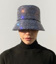 Ruslan Baginskiy Crystal-embellished Bucket Hat’s name says it all. It is a bucket hat, embellished with almost a bucket of crystals. Everyone may be dazzled by your glow, but the delicate brim of this limited-edition piece will protect your eyes from sun and party lights.
While wearing a hat is no more required in the XXI century, having fun is forever required! Having fun is essential, we would say. And you always get more fun with a proper accessory. Let’s dress up to the nines. Let’s dress up nine-to-five, twenty-four seven. Let’s be ironic enough to make glamour a part of our casual wardrobe. Twenty Four Seven, Plain Outfits, Hats Accessories, Online Shop Accessories, Wearing A Hat, Party Lights, The Nines, Having Fun, Casual Wardrobe