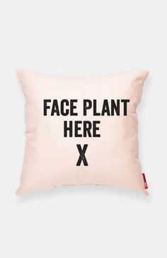 a pillow with the words face plant here x on it in black letters, against a white background