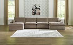 a living room with a sectional couch and rug