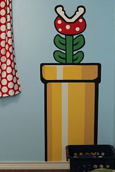 there is a flower pot painted on the wall in this child's playroom