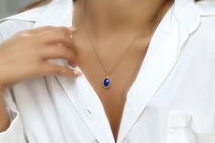 Effortlessly chic and intricate, this blue stone necklace gorgeously showcases a Lapis Lazuli stone, oval-cut and held in a delicately detailed setting. Lapis Lazuli is a September birthstone and will be a lovely touch of sophistication for everyday and special occasions. A stylish and vibrant jewelry piece for you or for a gift Finish is customizable to other materials Can be purchased in different necklace lengths Nickel Free and Tarnish Resistant Thoughtfully packaged with a fancy gift kit Pr September Birthstone Necklace, Oval Pendant Necklace, Blue Stone Necklace, Lapis Pendant, Lapis Necklace, Lapis Lazuli Pendant, Lapis Lazuli Necklace, Fancy Gifts, Lapis Lazuli Stone