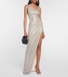 Sequined One Shoulder Gown in Silver - The Sei | Mytheresa Floor-length One Shoulder Dress With Sequins For Evening, Floor-length One Shoulder Sequin Evening Dress, One Shoulder Sequin Evening Dress, Glamorous Evening Gown With Asymmetrical Neckline, Sequined Gown With Asymmetrical Neckline, Glamorous Prom Gown With Side Slits, Glamorous Gown With Side Slits For Prom, Glamorous One-shoulder Dress With Asymmetrical Neckline, One-shoulder Sequin Maxi Dress For Evening