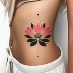 a woman's stomach with a flower tattoo on her belly and the bottom part of her lower body