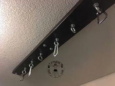 there are several hooks hanging from the ceiling