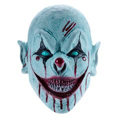 an evil clown mask with blue eyes and red nose paint on it's face