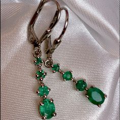 Genuine Brazilian Emerald Lever-Back Drop Earrings. Set In Platinum Over .925 Sterling Silver. Tgw 1.10 Carats. Drop 3/4” To 1 1/2”. Comes New In Box For Safekeeping And Gift Giving. Nwt Classic Emerald Dangle Jewelry, Fine Jewelry Oval Sterling Silver Earrings, Oval Sterling Silver Earrings Fine Jewelry, White Gold Dangle Jewelry With Lever Back Ear Wires, White Gold Dangle Jewelry With Lever Back, Green Prong-set Dangle Earrings, Sterling Silver Drop Earrings For May Birthstone, Classic Green Sterling Silver Earrings, 925 Stamped Drop Jewelry For Anniversary