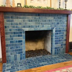 a blue brick fireplace in a living room