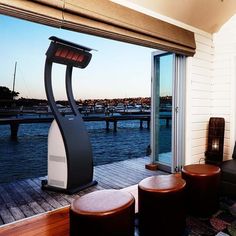 a living room with a large window overlooking the water