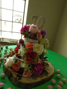 there is a cake with flowers on the table