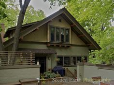 a house that is in the middle of a tree filled area with lots of trees