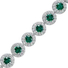 Give your look a vibrant update with this sophisticated green lab-created emerald and white lab-created sapphire frame tennis bracelet. Crafted in sterling silver This choice glistens with 5.0mm verdant-green lab-created emeralds. White lab-created sapphires wrap each stone in a shimmering frame. This 7.25-inch bracelet secures with a box clasp. Fine Jewelry Tennis Bracelet With Halo Setting, Classic Green Round Diamond Bracelet, Classic Green Bracelet With Brilliant Cut, Green Gemstone Tennis Bracelet, Classic Green Tennis Bracelet With Brilliant Cut, Green Tennis Bracelet With Prong Setting, Green Round Tennis Bracelet With Prong Setting, Round Green Diamond Emerald Bracelet, Green Gemstone Diamond Bracelet