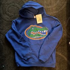 Florida Gators Sweatshirt, Blue Fleece Fan Merchandise Sweatshirt, Blue Fan Apparel Hoodie, Blue Cotton Hoodie For Fan Merchandise, Blue Hooded Sweatshirt Fan Apparel, Blue Hooded Hoodie For School, Blue Fleece Fan Apparel Hoodie, Blue Fleece Hoodie Fan Apparel, Blue Fan Apparel Hoodie Sweatshirt