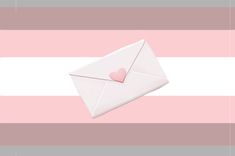 an open envelope with a heart on it sitting in front of a pink and white striped background