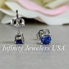 "The stud earrings pictured are lab created blue sapphire #5926 -Approximate total carat weight: .50ctw -Center Stone Size: 4mm - approx. .25ct each diamond equivalent -Gem Type: lab created sapphire -Stone Shape: round -Stone Clarity: VS2 -Stone Color: Blue - Shown in friction backs -Metal Type and Purity: 14k white gold -Setting: 4 prong basket style -Backing: Friction back (earring backs are subject to change due to availability) -Country of Manufacturing: USA (Michigan) For customization ple Blue Brilliant Cut Earrings For Anniversary, Classic Blue Sapphire Earrings, Blue Lab-created Sapphire Round Cut Earrings, Classic Blue Lab-created Sapphire Earrings, Blue Sterling Silver Earrings With Brilliant Cut, Blue Sapphire Earrings For Anniversary, Blue Earrings With Prong Setting For Anniversary, Classic Sapphire Earrings For Anniversary, Brilliant Cut Sapphire Earrings For Anniversary