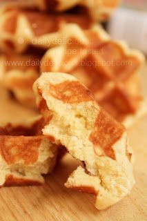 some waffles cut in half on a wooden table