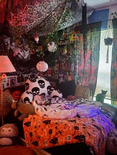 a bedroom decorated with halloween decorations and lights