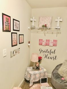 a bedroom with pink and gray decor on the walls