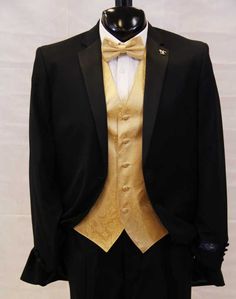 a black tuxedo with gold lapel and white shirt