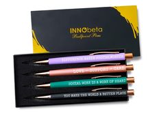 three pens in a black box with gold writing on them and the words innobeia written on it