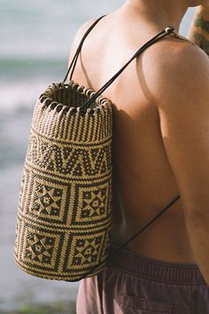 Indah means Beautiful in Indonesian, This is our signature backpack, handwoven in Kalimantan, Borneo island, Indonesia. Each piece has a unique pattern depending on the village in which it is created. Traditionally used to carry collected produce and goods, these baskets are resistant and long-lasting since they are made of a natural fiber called Rattan which is native to the region. Perfect for any beach day or farmers market run, adds a touch of style to anyone. Since every item is a work of a Backpack Basket, Borneo Island, Indonesian Design, Sustainable Shopping, Abstract Portrait, Basket Bag, Backpack Straps, Mens Accessories Fashion, New Arrival Dress