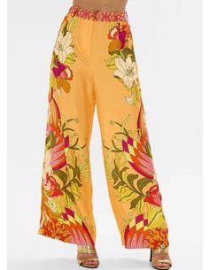 Camilla Wide Leg High Waisted Pant in The Flower Child Society. High rise. Wide leg. Contrast print waistband. Double button and zip fly closure. Belt loops. Elasticized waistband. Crystal embellishments. Welt pockets. The Flower Child Society print "depicts a 70's inspired scene of vibrant orange imbued with statement retro florals." 100% Silk. Handcrafted and designed in Australia. Silk Pants, 70s Inspired, Denim Flares, Skirt Leggings, Vibrant Orange, Flower Child, Resort Wear, High Waisted Pants, Playsuit Jumpsuit