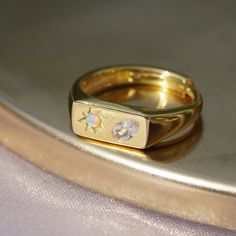 Drawing inspiration from the night sky, this sparkling celestial signet is adorned with a super unique oval stone and star-set opal stone for a magical reminder to always look up. Inspired by vintage heirloom styles, this delicate design is a modern take on the classic signet with a magical twist. Crafted in sterling silver this ring is perfect for stacking, and can be worn on any finger, on it's own or alongside other jewels for a stacked look. Made From:  ♡ 925 Sterling Silver or Gold Vermeil Vermeil Drawing, Celestial Opal Ring As Gift, Celestial Opal Birthstone Ring In Oval Shape, Celestial Oval Opal Birthstone Ring, Synthetic Opal, Delicate Design, The Night Sky, Opal Stone, Oval Stone