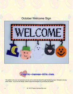 a welcome sign with halloween decorations hanging from it