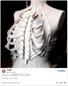 a mannequin is covered in white paper