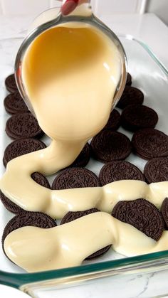 a glass dish filled with cookies and cream