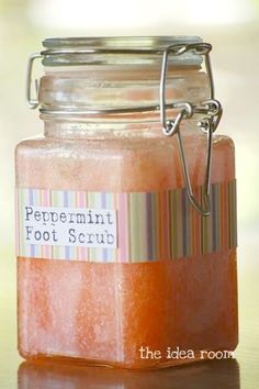 a jar filled with red liquid sitting on top of a table