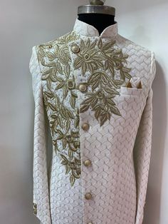 This sherwani comes with zari handwork.u can customised embroidery handwork according to ur choice.options available in above pictures. Includes- sherwani and bottom Colour options available. Customisation available. Traditional White Bandhgala For Wedding, White Festive Bandhgala For Groom, Festive White Bandhgala For Groom, White Traditional Wear With Resham Embroidery For Groom, Fitted Dabka Kurta For Groom, White Unstitched Suit With Naqshi For Formal Occasions, White Unstitched Wedding Suit With Dabka, Formal White Unstitched Suit With Naqshi, White Nehru Jacket With Dabka For Wedding