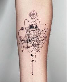 an astronaut tattoo on the leg