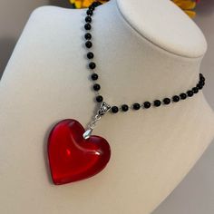 Black Beaded Necklace With Big Large Red Glass Crystal Heart Pendant Charm Brand New Big Red Crystal Glass Heart Charm Pendant Choker Necklace 3d Heart Pendant Chunky Heart Necklace Super Adorable Necklace, You Will Love The Contrast Between The Red Heart And The Black Of The Beads. *Glass Heart Pendant Size: 43mm *Necklace Length: 34cm+5cm Extension Chain. *Brand New. *Will Ship Next Day Or Same Day If Possible. *Make A Bundle Of 2 Or More Items And Save $2 (Message Me First!) #Bigredcrystalheartnecklace##Glassheart#Heartpendant Tags: Fairycore Jewelry Handmade Necklace Handmade Jewelry Cottagecore Healing Crystals Crystal Jewelry Crystal Necklace Boho Witchy Pixie Fae Boho Unisex Heart Beaded Necklaces For Parties, Party Heart-shaped Beaded Necklaces With Heart Beads, Party Beaded Necklaces With Heart Pendant, Heart-shaped Beaded Necklace For Parties, Black Heart Beads Necklace For Valentine's Day, Black Heart Beaded Necklace, Handmade Black Necklace For Valentine's Day, Handmade Black Heart-shaped Beaded Necklaces, Handmade Black Heart Beaded Necklaces