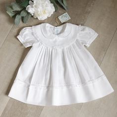 This Feltman Brothers White Heirloom Dress In Size 6 Months Is Heavenly!!! This Particular Style Was A Limited Edition And Is No Longer In Production. The Gorgeous Dress Is Done In A White Cotton Blend For Easy Care. The Double Collar Is What Sets This Dress Apart From The Rest!! A Wide, Round Bib-Style Collar Is Adorned With White Floral And Dot Embroidery. The Edge Is Trimmed In A Delicate White French Lace That Is Hand-Faggoted To The Collar (A High-End Heirloom Stitch). Atop The Large Round Classic Short Sleeve Cotton Baptism Dress, Cotton Baptism Dress With Short Sleeves, Heidi Klum Dress, Feltman Brothers, Dot Embroidery, Beaded Formal Dress, Heirloom Dresses, Double Collar, White Eyelet Dress