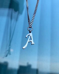 Letter A necklace, set on a stainless steel ,silver color chain. Chain length 18" Beautiful spiritual gift. Please make sure you to pay attention to the size of the pendant. I have added pictures next to 25 cent coin, and measurement tape.  Need a different length just write it to me in the "message to the seller" box of the order form. **LIMITED SUPPLY** All of our jewelry comes wrapped and ready for gift giving! To see more, please visit my shop at http://www.etsy.com/ca/shop/BadassjewelryToro Trendy Silver Name Necklace As Gift, Trendy Silver Name Necklace For Gift, Trendy Silver Name Necklace, Everyday Silver Name Necklace With Initials, Trendy Silver Name Necklace As Personalized Gift, Trendy Silver Charm Necklace For Personalized Gift, Trendy Silver Charm Necklaces With Custom Name, Trendy Silver Hypoallergenic Charm Necklace, Trendy Hypoallergenic Silver Charm Necklace