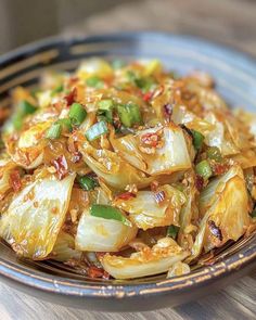 a close up of a plate of food with onions and celery on it