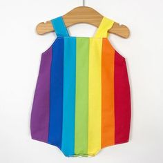 Baby rainbow romper. Poppers for easy changing, relaxed fit, plenty of room for nappies (cloth or disposable). Fully lined with light soft cotton. Seamless insides making them comfortable against babies skin. Rainbow design made up of carefully selected colours of 100% premium quality cotton. Adjustable length straps. Sleeveless Summer Overalls For Playtime, Cute Multicolor Jumpsuits And Rompers For Playtime, Multicolor Cotton Onesie For Summer, Sleeveless Cotton Overalls For Playtime, Playful Multicolor Bodysuit For Playtime, Cute Multicolor Onesie For Playtime, Cute Multicolor Cotton Bodysuit, Cute Multicolor Playtime Bodysuit, Multicolor Bubble Romper For Summer Playtime