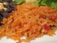 rice and black beans on a plate with lettuce