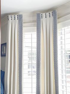 the curtains in this room are white and blue